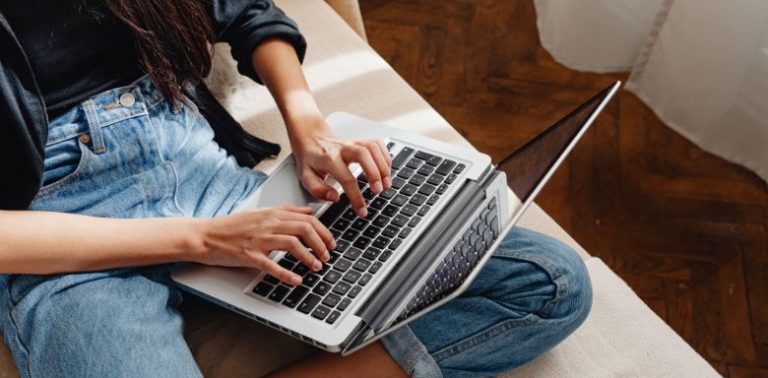 A woman using a laptop.