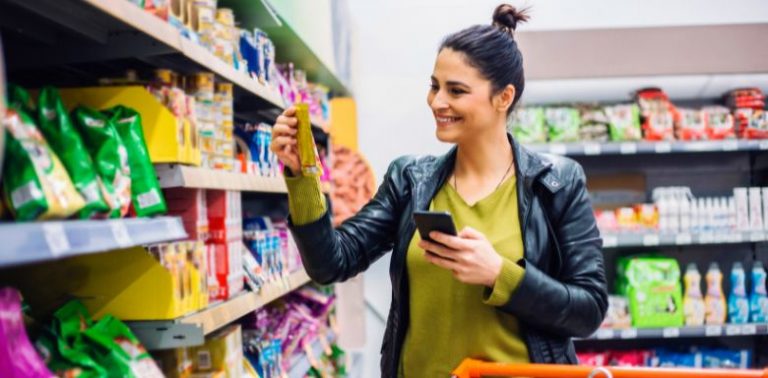 A woman shopping in a grocery store.