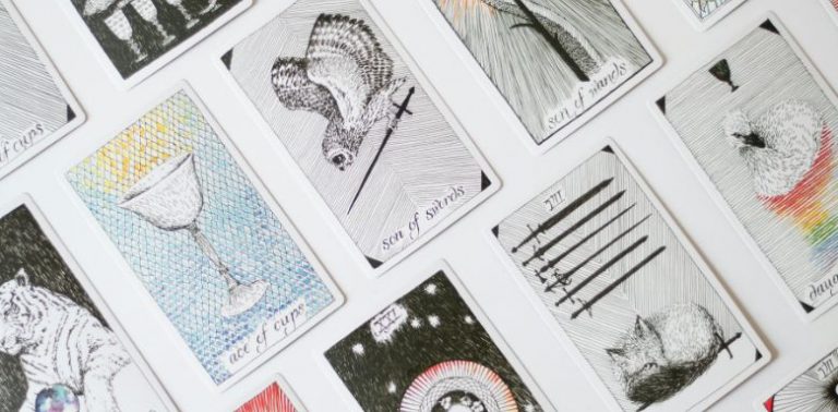 Tarot cards lined up in multiple rows.