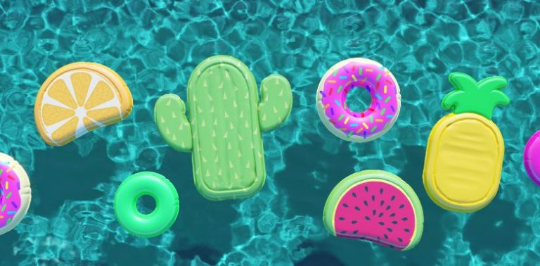 A top-down view of a pool, with different pool inflatables including a cactus, watermelon, pineapple and more.