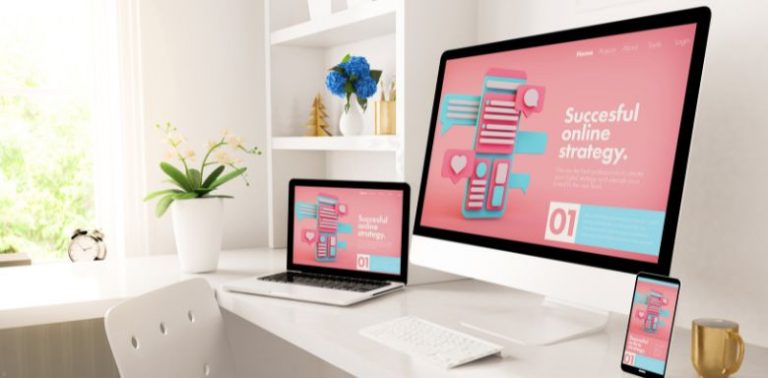 Computer monitors showing a pink screen with digital marketing strategies.
